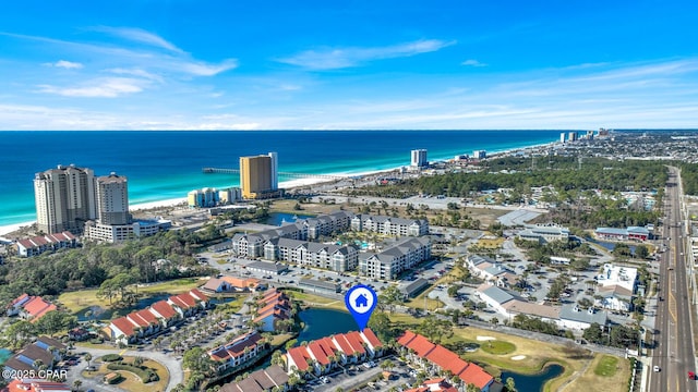 drone / aerial view with a water view and a view of the beach