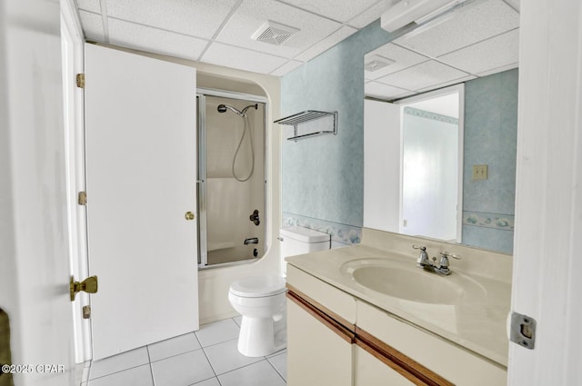 full bathroom with toilet, a paneled ceiling, tile patterned floors, shower / tub combination, and vanity