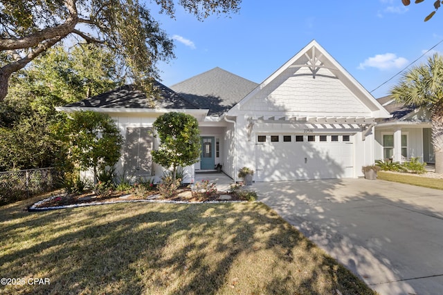 view of front of house with a garage and a front yard