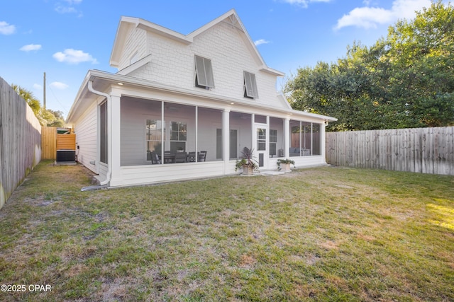 back of property with a lawn, central AC, and a sunroom