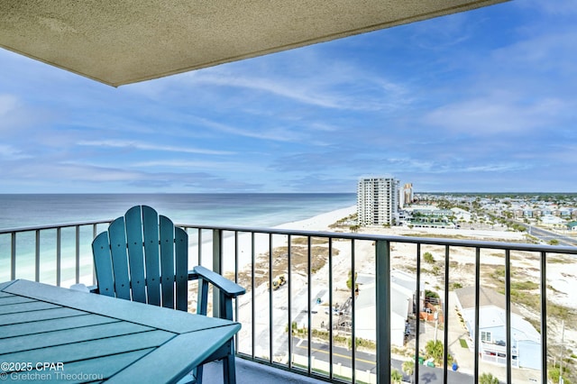 balcony with a beach view and a water view