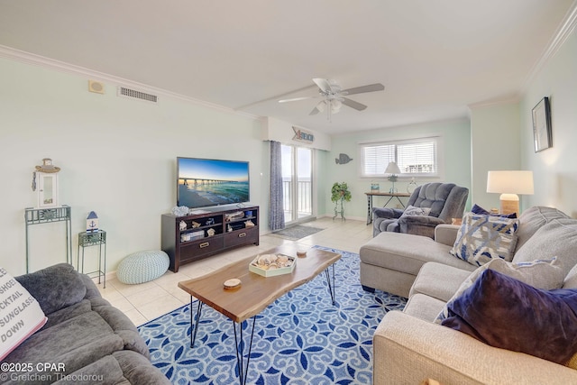 tiled living room with ceiling fan and ornamental molding