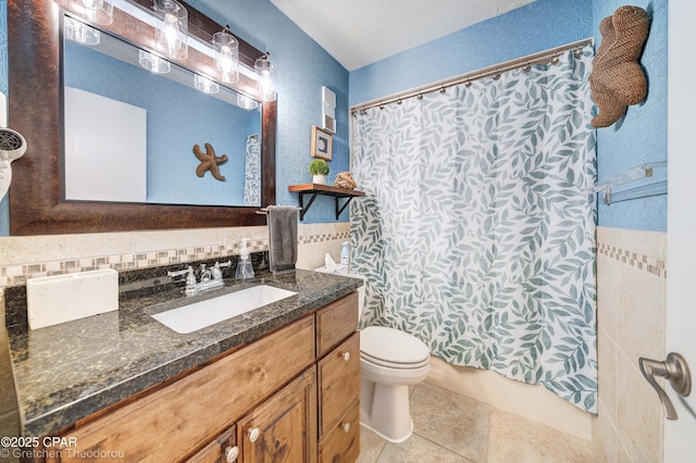 bathroom with toilet, vanity, tile patterned floors, and decorative backsplash