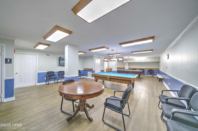 rec room with wood-type flooring, pool table, and ornamental molding