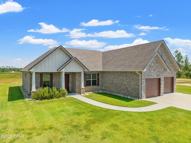 view of front of home featuring a garage and a front yard