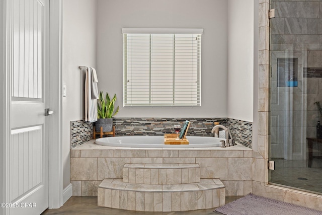 bathroom featuring separate shower and tub