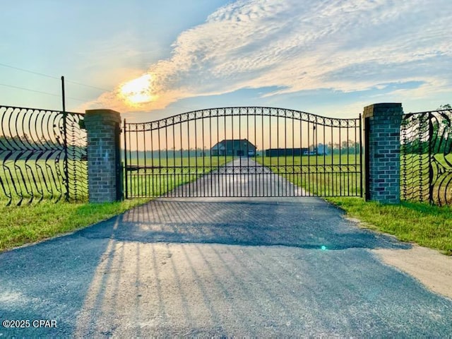 view of gate at dusk