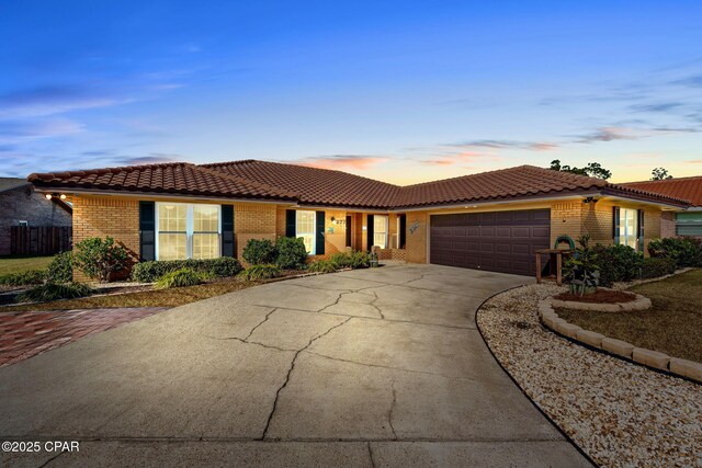 ranch-style house featuring a garage