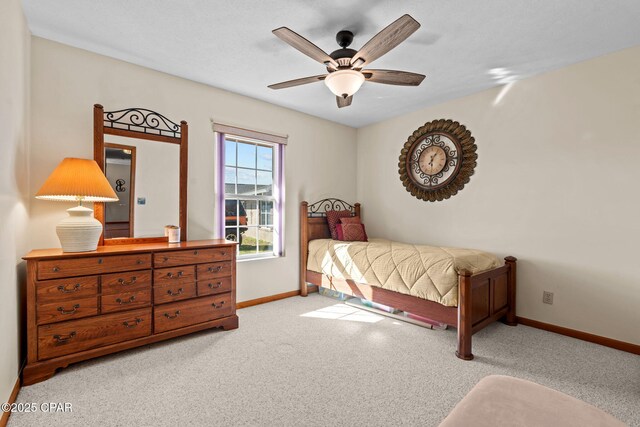 bedroom with light colored carpet and ceiling fan