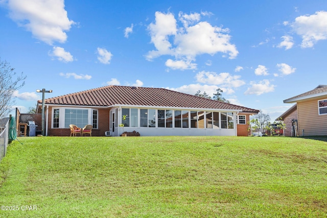 back of house with a yard