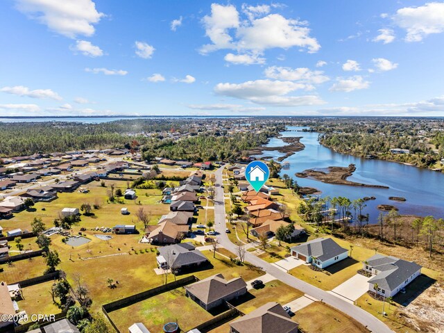 drone / aerial view with a water view