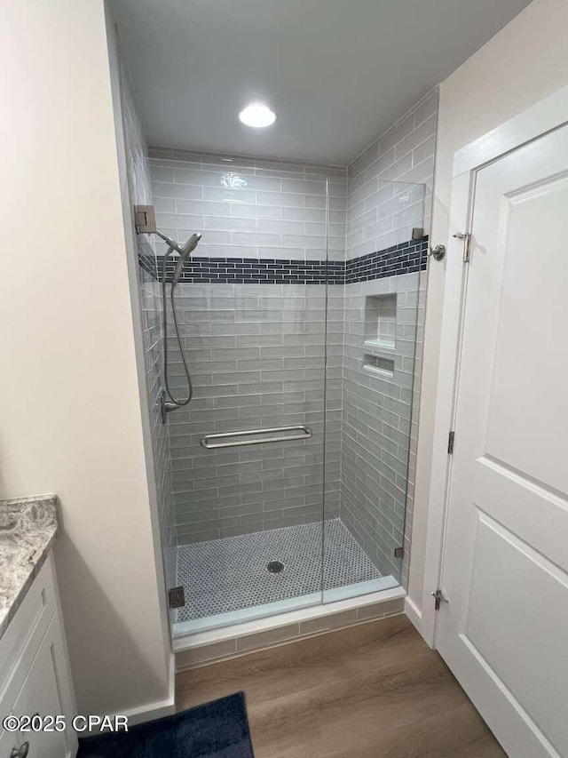 145 Turtle Walk Unit 60, Port St Joe, FL 32456 - full bathroom with a shower stall, wood finished floors, vanity, and recessed lighting