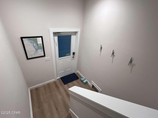 145 Turtle Walk Unit 60, Port St Joe, FL 32456 - doorway to outside featuring wood finished floors and baseboards