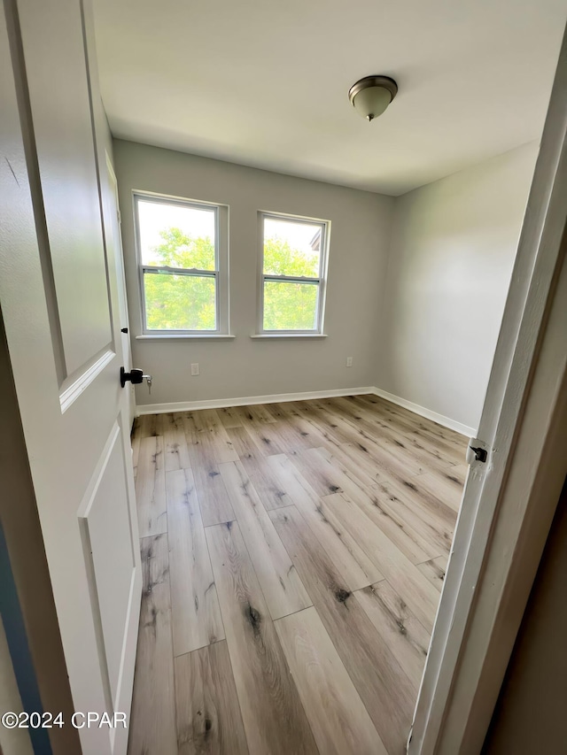 1730 Mallard Dr Apt F, Panama City, FL 32404 - unfurnished room featuring baseboards and wood finished floors