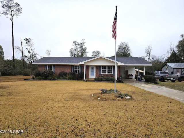 ranch-style house with a front yard and a carport