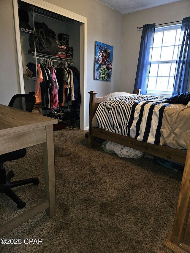 carpeted bedroom with a closet