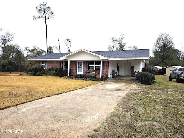 single story home featuring a front yard and a carport