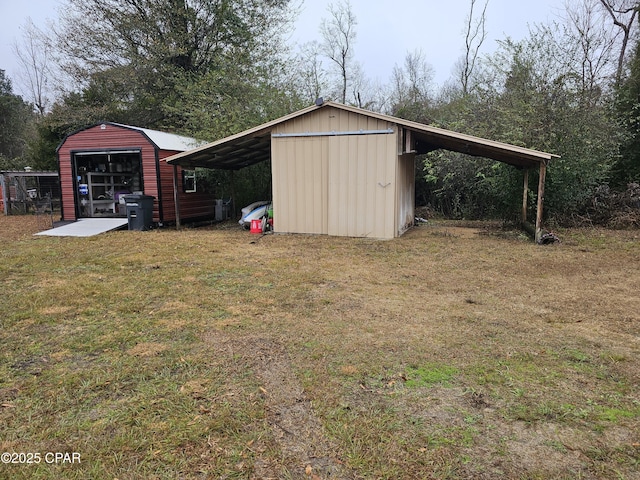 view of outbuilding featuring a yard and a carport