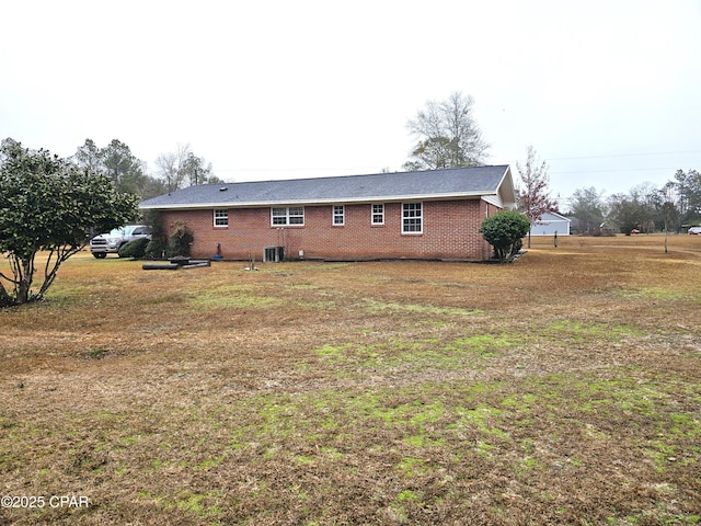 back of house featuring central AC