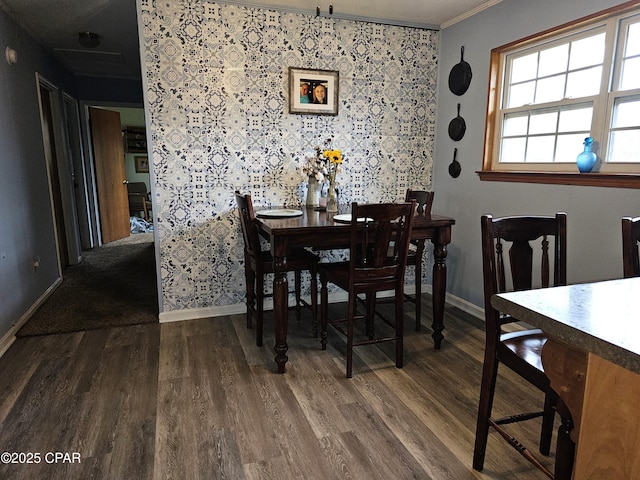 dining room with dark hardwood / wood-style flooring and ornamental molding