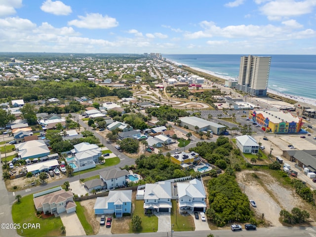 drone / aerial view with a water view and a beach view