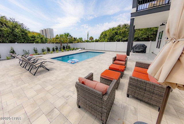 view of pool featuring a patio area