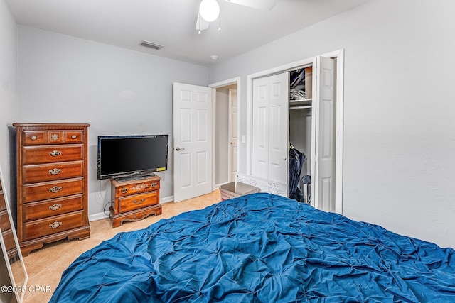 bedroom with baseboards, visible vents, a closet, and ceiling fan