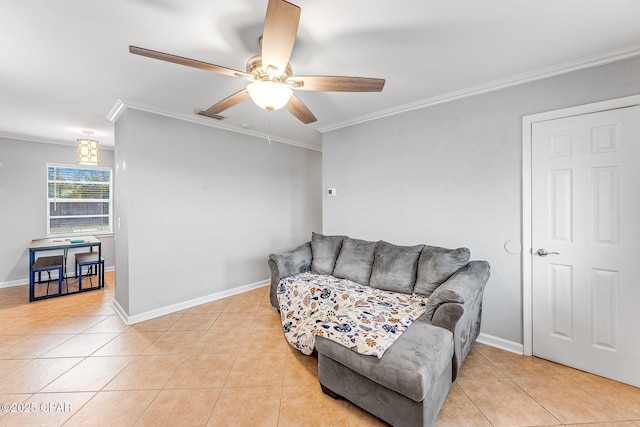 living area with baseboards, light tile patterned flooring, a ceiling fan, and ornamental molding