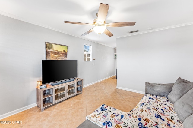 living room with light tile patterned floors, visible vents, baseboards, and ornamental molding