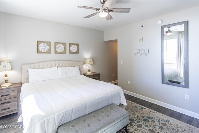 bedroom with ceiling fan and dark hardwood / wood-style flooring