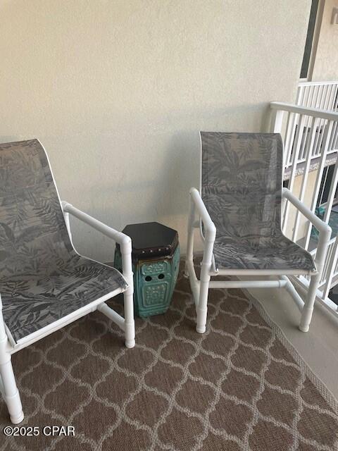 sitting room with dark colored carpet