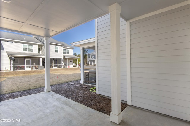 view of patio featuring a sunroom