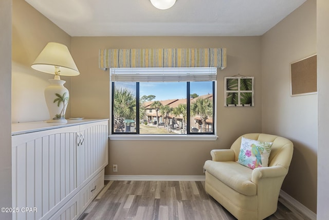 sitting room featuring wood finished floors and baseboards