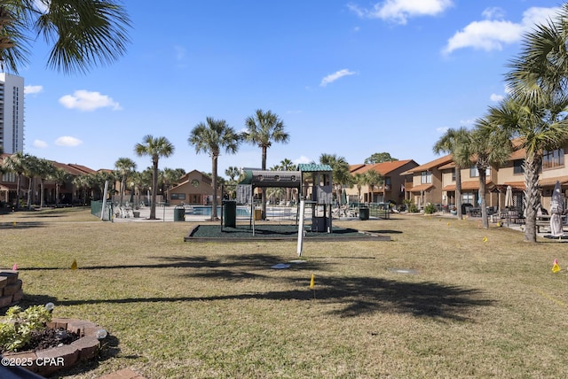 view of jungle gym featuring a residential view and a lawn