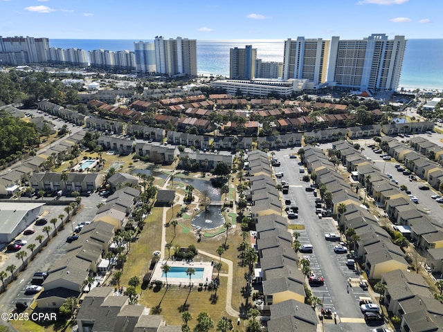 aerial view featuring a view of city and a water view