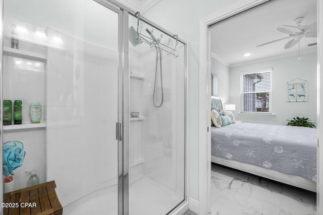 bathroom featuring a shower with door, crown molding, and ceiling fan