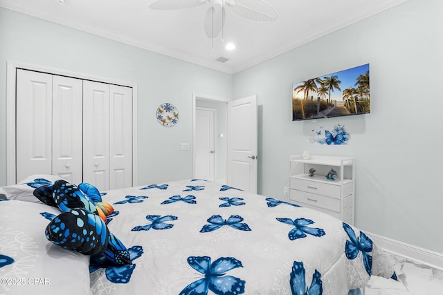 bedroom featuring ceiling fan, a closet, and crown molding