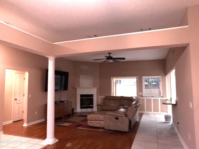 living room featuring ceiling fan and light hardwood / wood-style floors