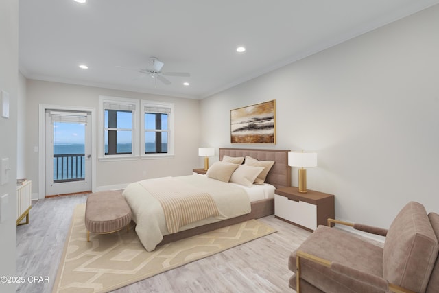 bedroom featuring access to exterior, crown molding, and light hardwood / wood-style flooring