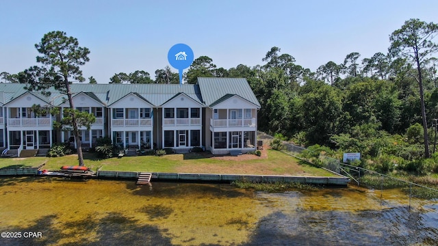 rear view of house with a lawn