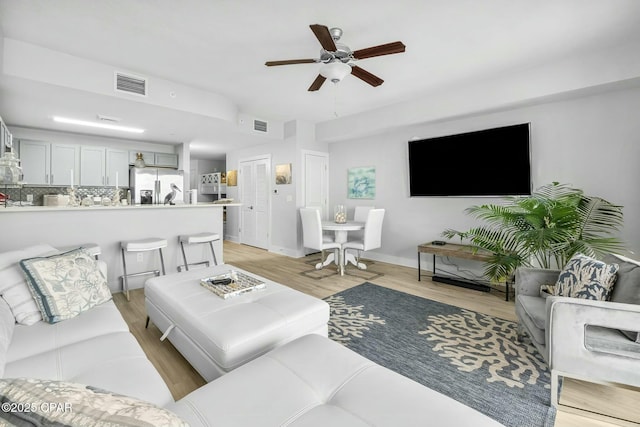 15928 Front Beach Rd Unit 3-1610, Panama City Beach, FL 32413 - living room featuring light wood-style flooring, a ceiling fan, and baseboards