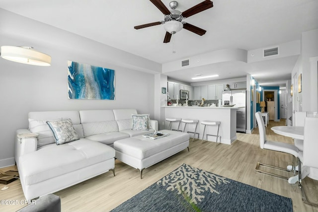 15928 Front Beach Rd Unit 3-1610, Panama City Beach, FL 32413 - living area with a ceiling fan, light wood-style floors, and baseboards