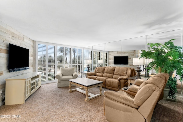 living room with light colored carpet and a wall of windows