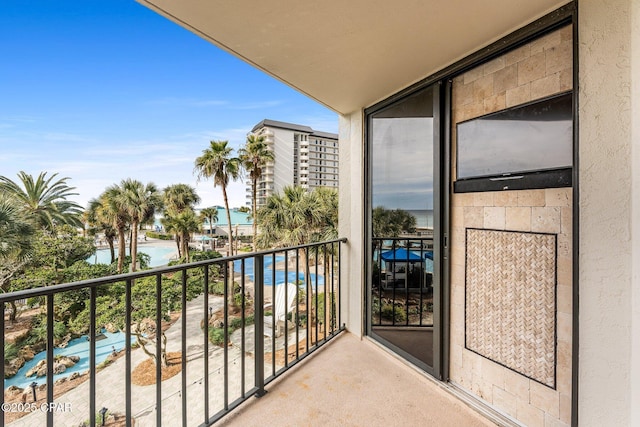 balcony featuring a water view