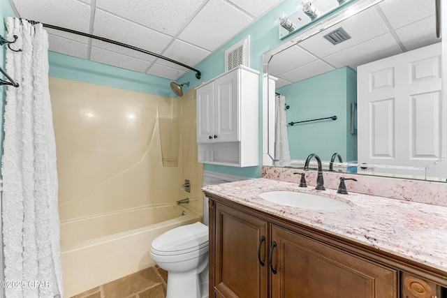 full bathroom with toilet, a drop ceiling, shower / bath combination with curtain, and vanity