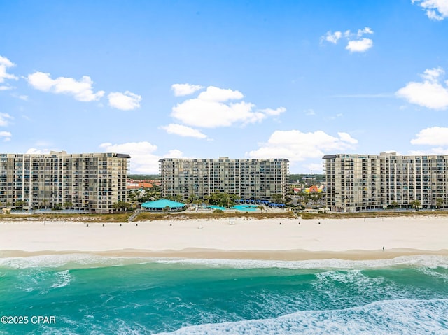 aerial view with a water view and a view of the beach