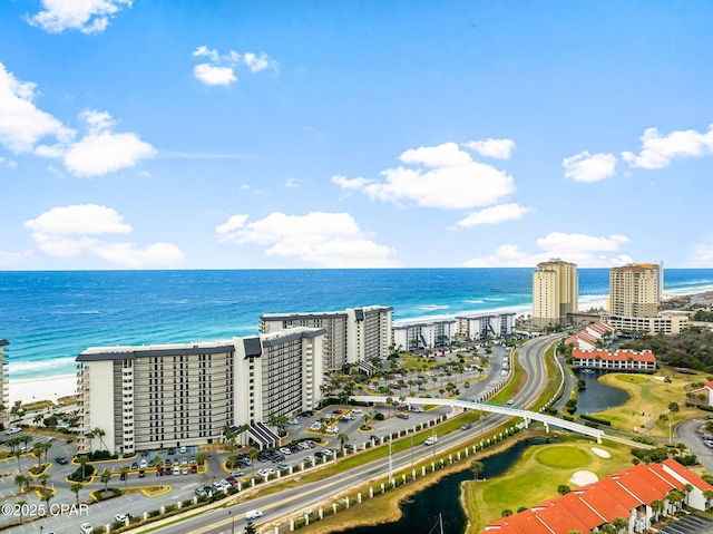 bird's eye view featuring a view of the beach and a water view