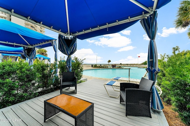 wooden deck featuring a water view