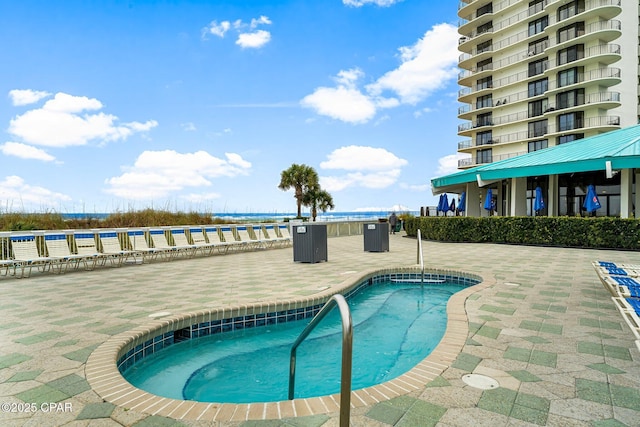 view of swimming pool featuring a patio area