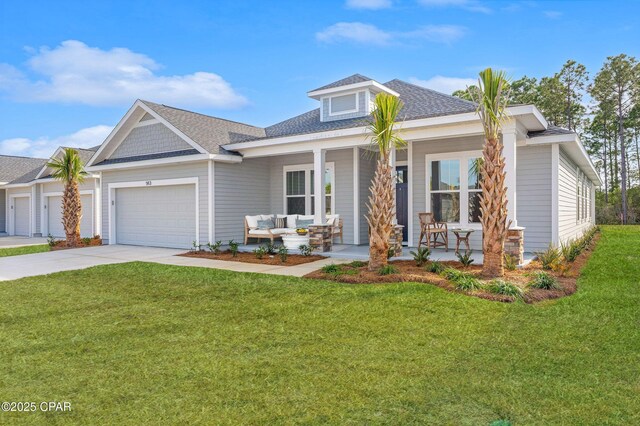 view of front of home with a garage and a front lawn